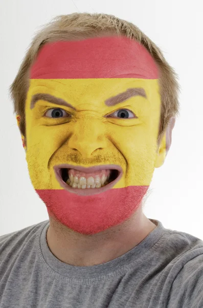 Rosto de louco homem zangado pintado em cores da bandeira da Espanha — Fotografia de Stock