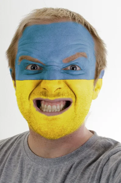 Face of crazy angry man painted in colors of Ukraine flag — Stock Photo, Image