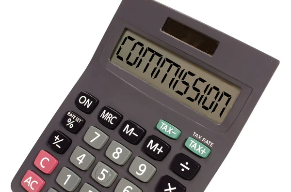 Ancienne calculatrice sur fond blanc montrant le texte "commision" en p — Photo