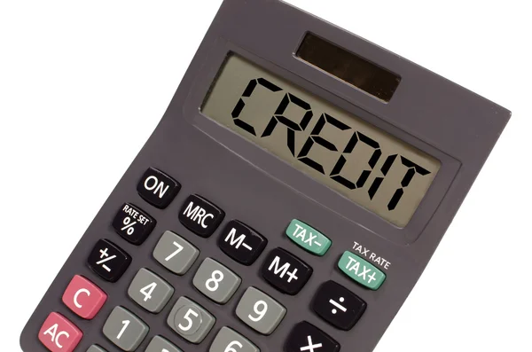 Old calculator on white background showing text "credit" in pers — Stock Photo, Image