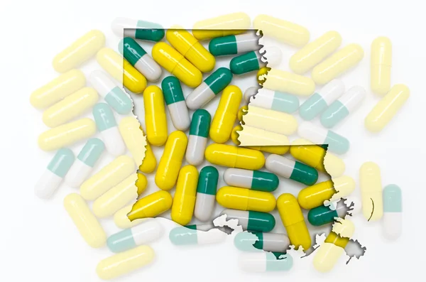 Konturkarta över luisiana med transparent piller i bakgrunden — Stockfoto