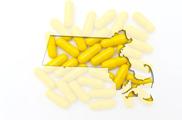 Outline map of Massachusetts with transparent pills in the backg — Stock Photo, Image