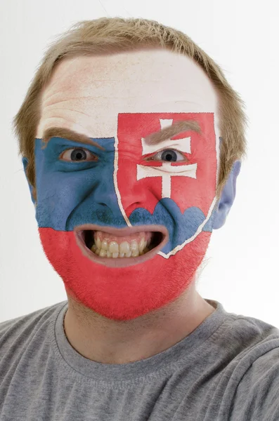 Cara de loco hombre enojado pintado en colores de la bandera de Eslovaquia —  Fotos de Stock