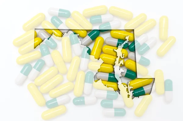Outline map of maryland with transparent pills in the background — Stock Photo, Image