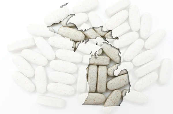 Umrisskarte von Michigan mit transparenten Pillen im Hintergrund — Stockfoto