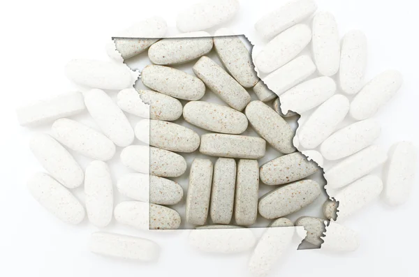 Outline map of missouri with transparent pills in the background — Stock Photo, Image