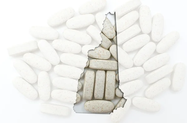 Umrisskarte von Neu-Ampshire mit transparenten Pillen im Rücken — Stockfoto