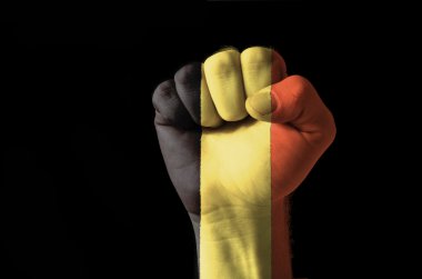 Fist painted in colors of belgium flag clipart