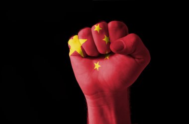 Fist painted in colors of china flag clipart