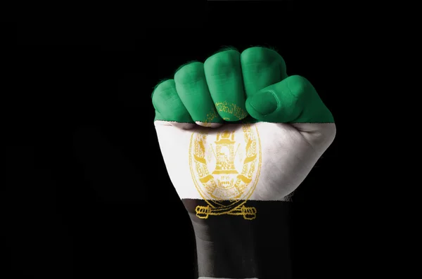 Vuist geschilderd in kleuren van aghanistan vlag — Stockfoto