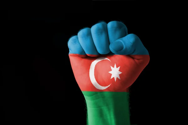 Vuist geschilderd in kleuren van de vlag van Azerbeidzjan — Stockfoto