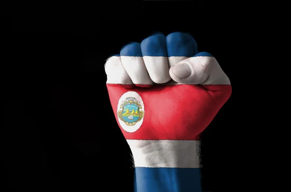 Кулак, раскрашенный в цвета флага Коста Рика — стоковое фото