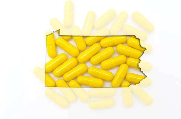 Outline map of pennsylvania with transparent pills in the backgr — Stock Photo, Image