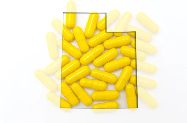 Overzicht van de selecteur van utah met transparante pillen op de achtergrond — Stockfoto