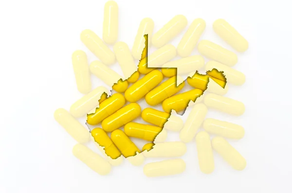 透明の丸薬、背景に隠れてとウェスト バージニア州の概要マップ — ストック写真