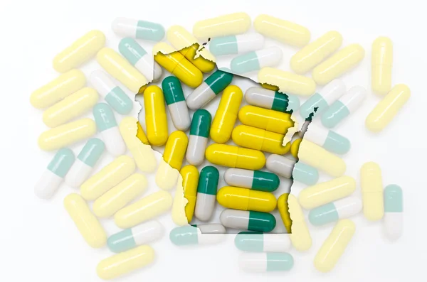 Outline map of wisconsin with transparent pills in the backgroun — Stock Photo, Image