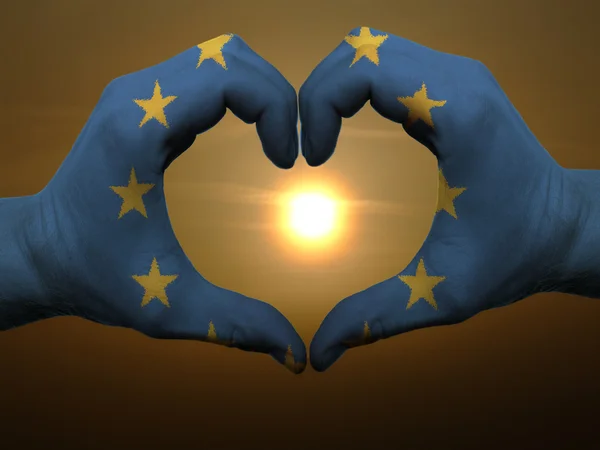 Heart and love gesture by hands colored in eu flag during beauti — Stock Photo, Image