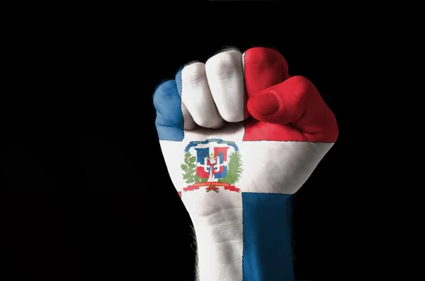 Pugno dipinto con colori di bandiera dominica — Foto Stock