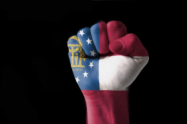 Fist painted in colors of great georgia flag — Stock Photo, Image