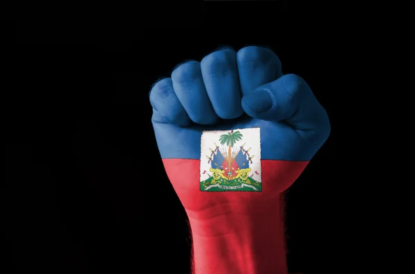 Fist painted in colors of haiti flag — Stock Photo, Image