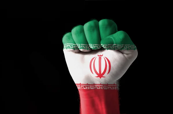Vuist geschilderd in kleuren van iran vlag — Stockfoto