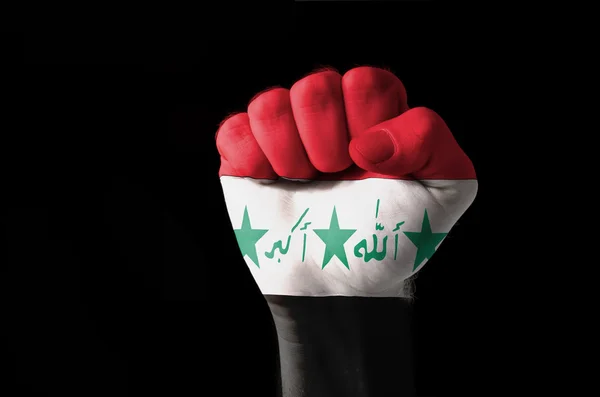 Pięść pomalowane w kolorach flagi Iraku — Zdjęcie stockowe