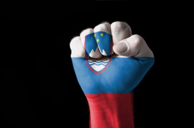 Fist painted in colors of slovenia flag clipart