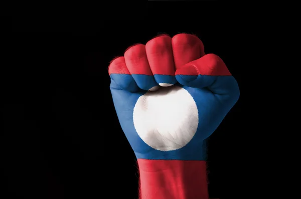 ラオスの国旗の色で描かれた拳 — ストック写真