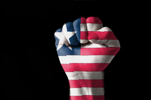 Fist painted in colors of liberia flag — Zdjęcie stockowe