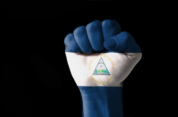 Fist painted in colors of nicaragua flag — Stock Photo, Image