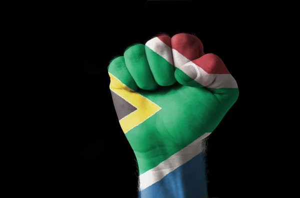 Vuist geschilderd in kleuren van de vlag van Zuid-Afrika — Stockfoto