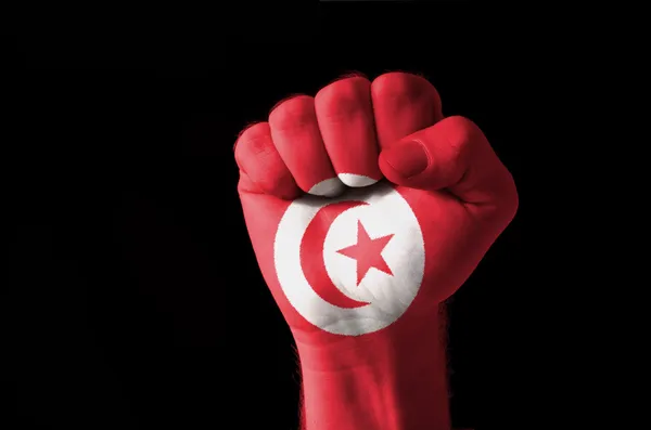 Näve målade i färgerna på Tunisien flagga — Stockfoto