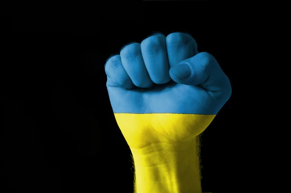 Fist painted in colors of ukraine flag — Stock Photo, Image