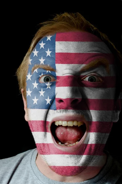 Face of crazy angry man painted in colors of american flag — Stock Photo, Image