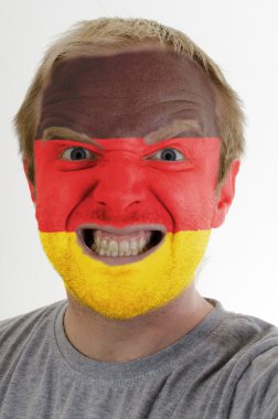 Face of crazy angry man painted in colors of german flag clipart