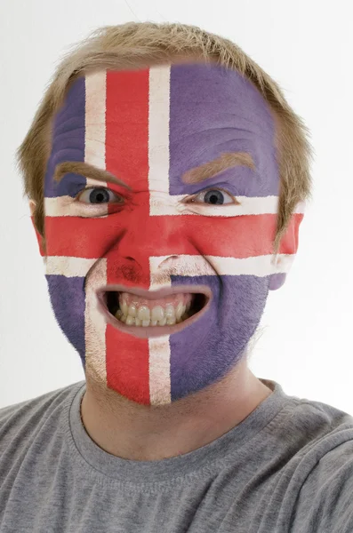 Őrült dühös ember arca festett Izland lobogója — Stock Fotó