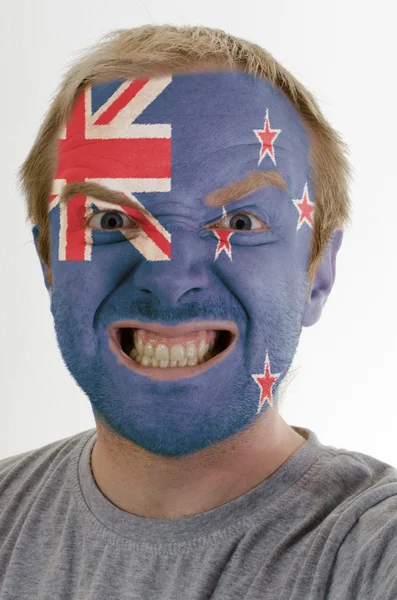 Face of crazy angry man painted in colors of new zealand flag — Stock Photo, Image