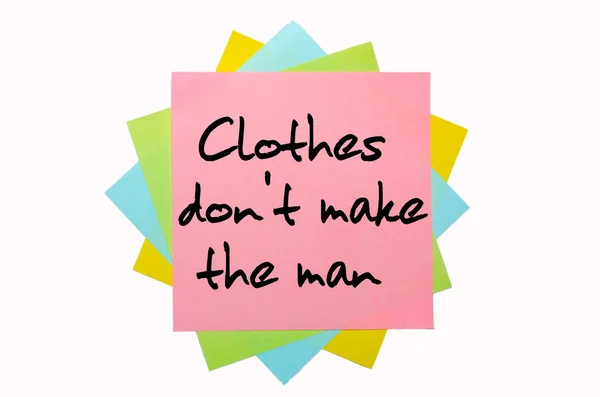 Proverb "Clothes don't make the man" written on bunch of sti — Stock Photo, Image