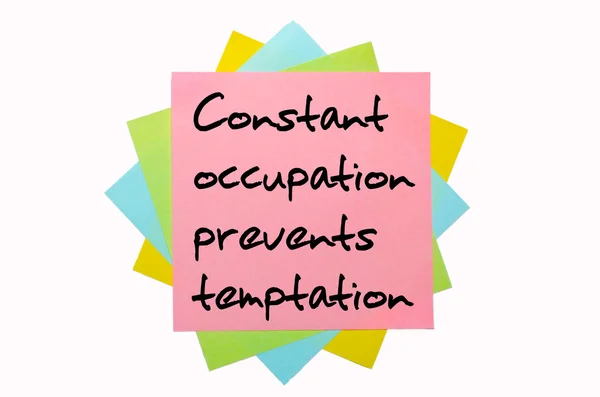 Proverb "Constant occupation prevents temptation" written on bun — Stock Photo, Image