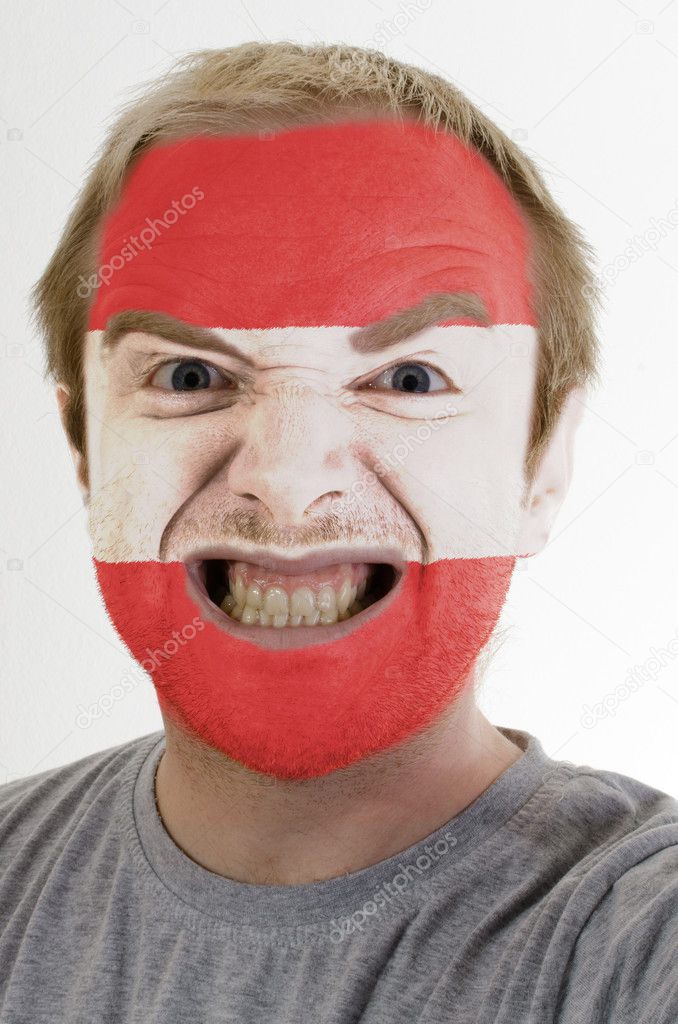 Face of crazy angry man painted in colors of austria flag