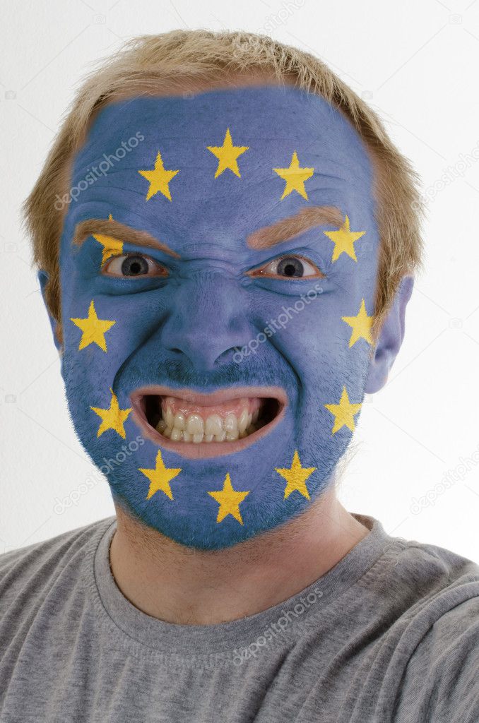 Face of crazy angry man painted in colors of europe flag