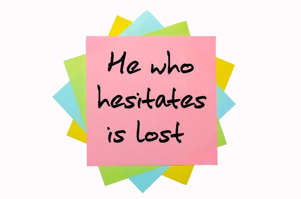 Proverb " He who hesitates is lost " written on bunch of sticky — Stock Photo, Image