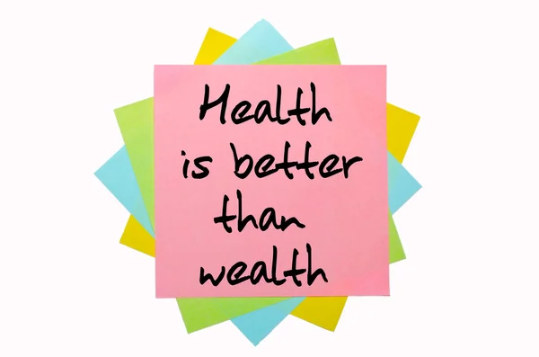Sprichwort "Gesundheit ist besser als Reichtum" steht auf einem Bündel sti — Stockfoto