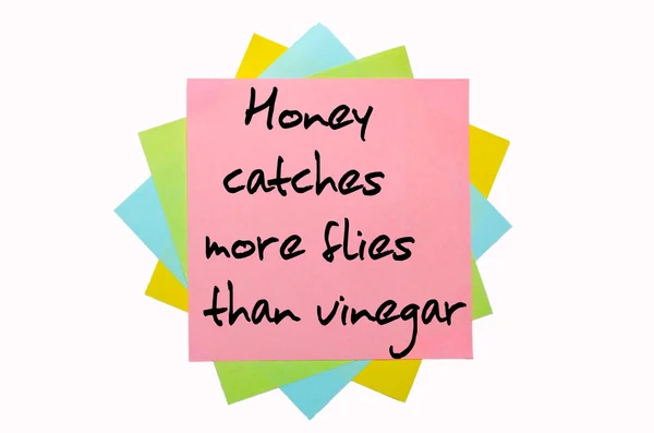 Proverb " Honey catches more flies than vinegar " written on bun — Stock Photo, Image