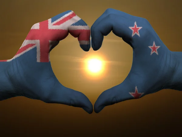 Heart and love gesture by hands colored in new zealand flag duri — Stock Photo, Image