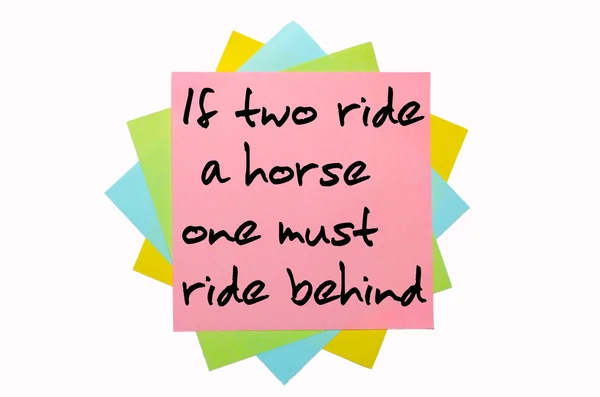 Proverb " If two ride a horse, one must ride behind " written on — Stock Photo, Image
