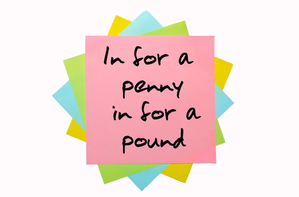 Proverb " In for a penny, in for a pound " written on bunch of s — Stock Photo, Image