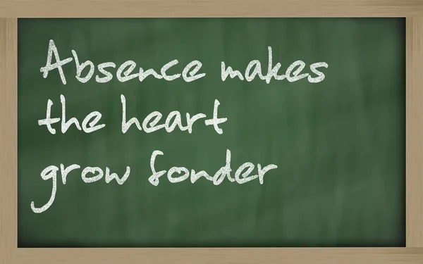 " Absence makes the heart grow fonder " written on a blackboard — Stock Photo, Image