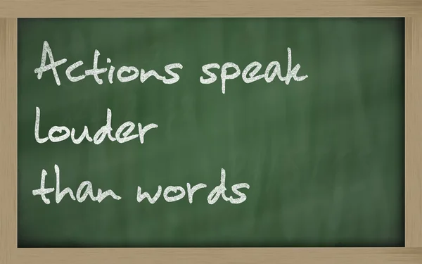 " Actions speak louder than words " written on a blackboard — Stock Photo, Image