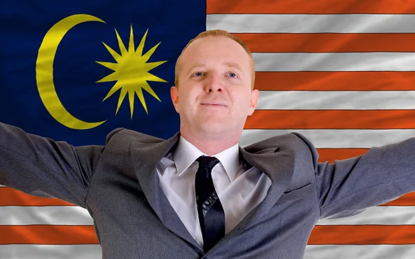 Happy businessman because of profitable investment in malaysia s — Stock Photo, Image